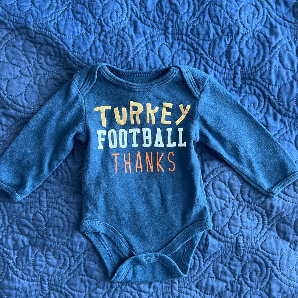 Chick pea 0-3 months baby onesie.  Turkey, football, thanks.  Blue.  Super cute!